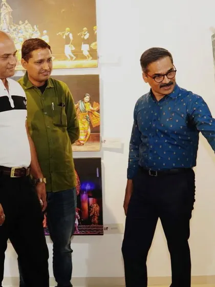 Discussing a photograph with Dr. Ravindra Singhal at his exhibition. His work is a challenging and artistic take on our cultural traditions.