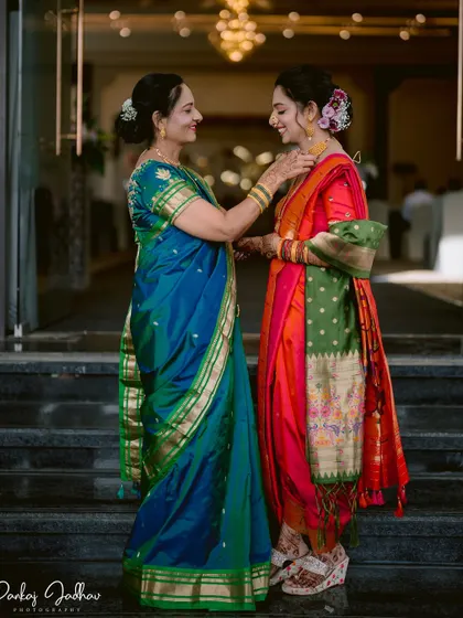 A mother's touch. A touching moment between the bride and her mother during the engagement ceremony.