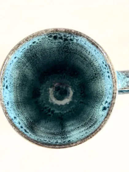 A top-down view into the geometric mug, showing the beautiful pooling of the glaze on the inside.