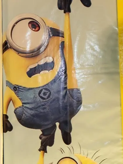 A detail from the Minions backdrop, featuring the mischievous characters and their favorite food, bananas. This playful wallpaper was a key element in creating an immersive and fun environment.