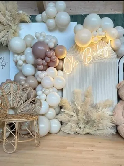 A close-up of the boho teddy bear baby shower decor, highlighting the mix of balloon sizes and the "We Can Bearly Wait" signage. This theme is perfect for a gender-neutral or modern baby celebration.