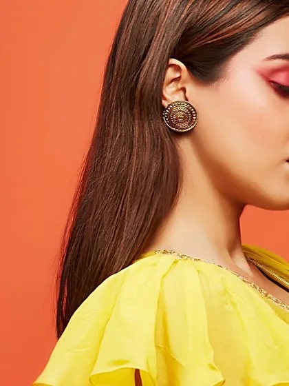A profile view of the editorial makeup for Three Three Store, highlighting the vibrant pink eyeshadow. The look is clean and modern, with a pop of color that adds a creative touch to the ethnic wear campaign.