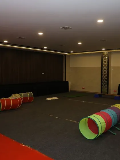 The "Sensory Obstacle Walk" setup with colorful play tunnels.