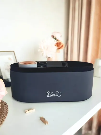 The personalized Dyson hairdryer case, styled on a desk. This shows how a touch of calligraphy can transform a high tech product into a piece of personal art.