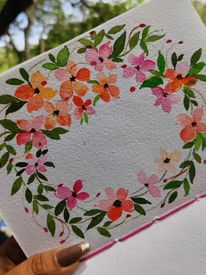 A delicate floral wreath painted in my sketchbook. Wreaths are one of my favorite compositions, perfect for custom cards, invitations, or as a standalone piece of art.