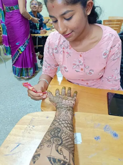 A photo of me participating in a mehendi competition at my college. I love challenging myself and showcasing my art.