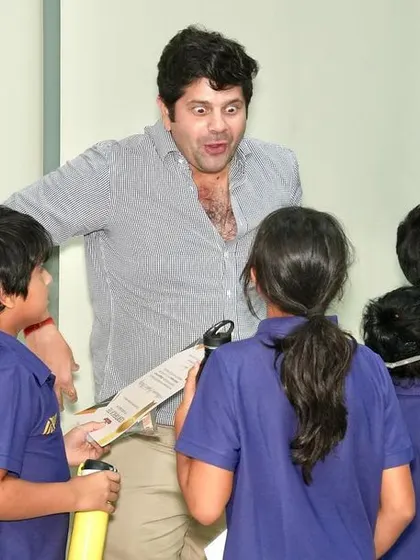 A parent's animated expression while interacting with the kids.