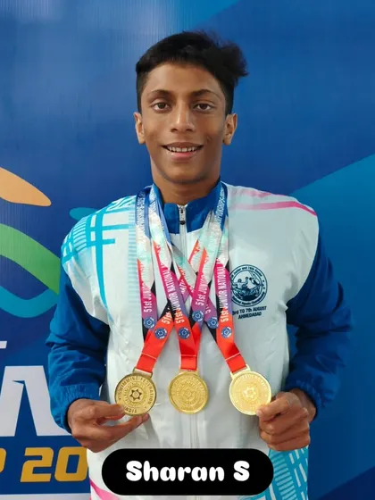Sharan S displaying his multiple gold medals from the championship.