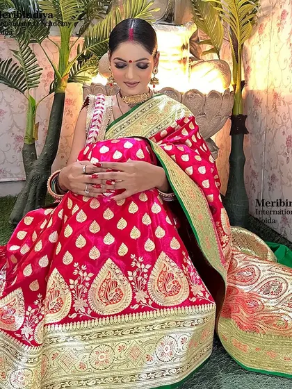 A graceful pose showing the beautiful draping of the saree and the neat, traditional hairstyle suitable for the festival.