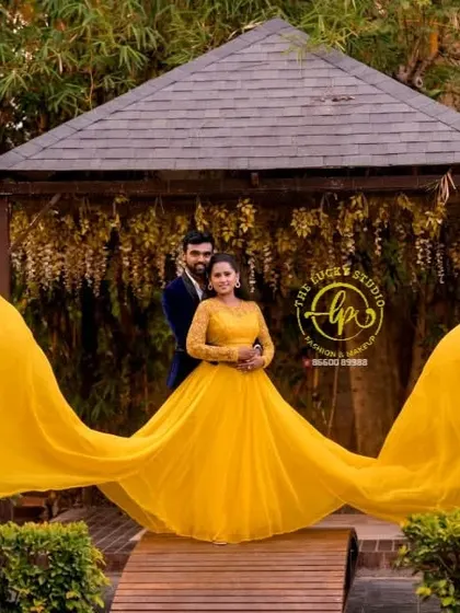 A symmetrical shot showing the full spread of the yellow flying gown. This is a perfect example of the grand, cinematic look we can achieve.