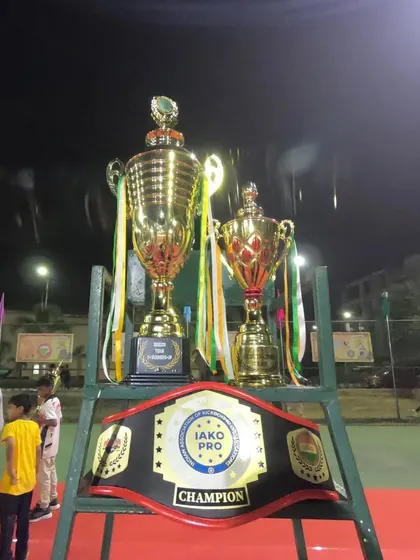 The spoils of war. The IAKO Pro Champion Title Belt and team trophies, earned through the hard work of our entire squad.
