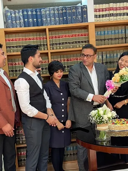 Our team celebrating and presenting flowers to Senior Advocate Pradeep Rai Sir on his birthday. We deeply value his guidance and leadership in our professional lives.