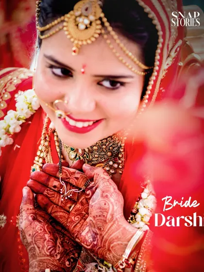 A close-up of a bride displaying her mangalsutra. We capture the significant details and symbols of your marriage ceremony.