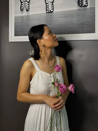 This image captures a soft, romantic makeup look created by a student. The focus is on glowing skin, a hint of blush, and a natural lip color for an elegant and timeless vibe.