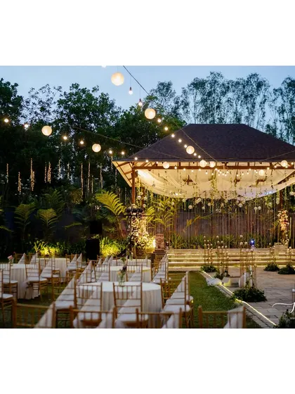 Another perspective of the Sangeet decor, highlighting the beautiful lighting and the elegant seating arrangement.