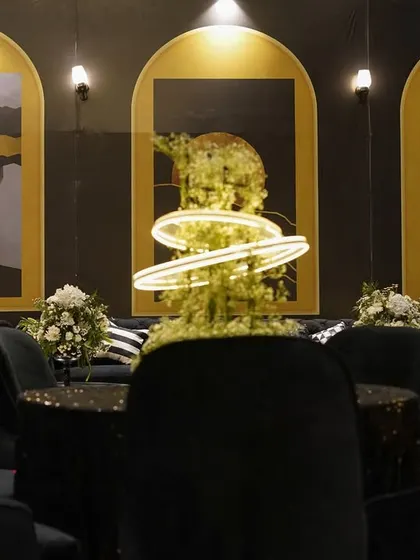 Where luxury wore black and elegance glowed in gold. This setup for a Sangeet night was moody, modern, and magnificently chic, with velvet textures, abstract art, and statement lighting.
