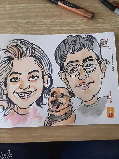This live drawing captures the likeness of the owners and their pet in a quick, charming sketch.
