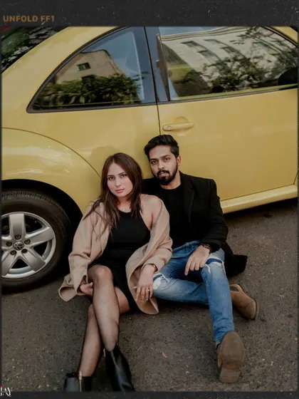 A direct, editorial-style portrait of the couple, showcasing their confident and cool vibe.
