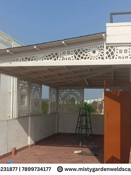 An elegant terrace enclosure featuring custom CNC designer frames. These panels add an artistic touch while providing privacy and structure to the space.