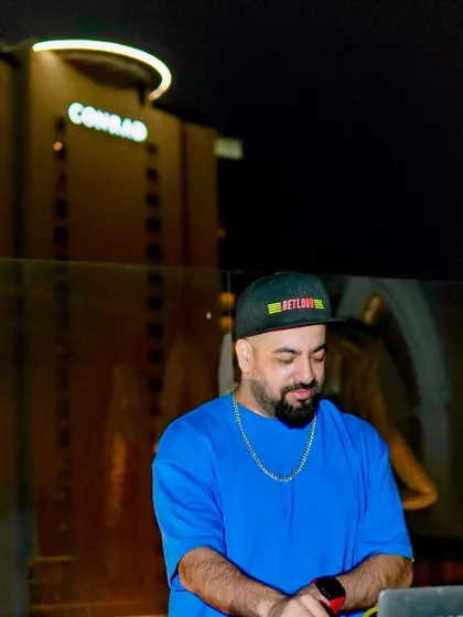Focused on the mix during a rooftop party at the Conrad. Every track is chosen to complement the sundowner vibe.