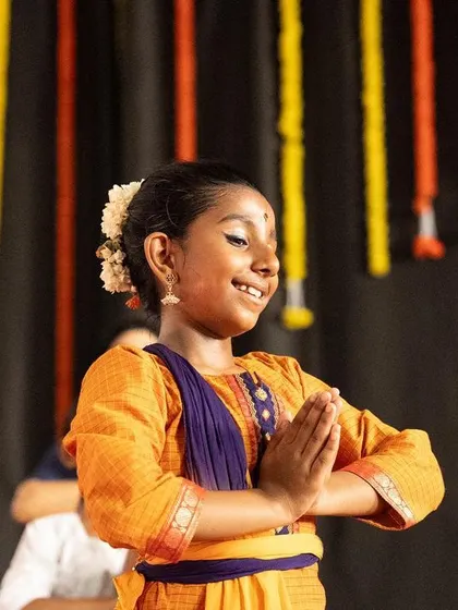 The joy on a young student's face during a performance is priceless. This is what we strive for in our classes, to nurture a love for dance that shines through on stage.