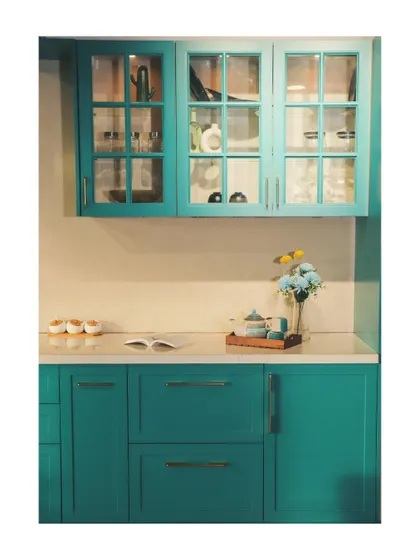 The full view of the teal crockery unit, showcasing its classic design with a modern pop of colour.