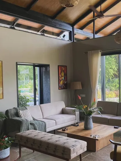 The living room of Grove House before final styling, showing the architectural volume and connection to the outdoors.