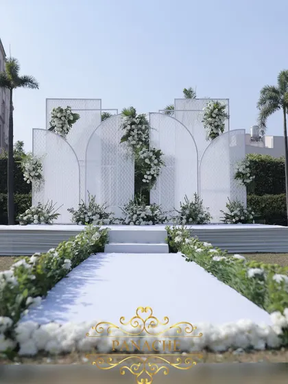 The view down the aisle towards the beautiful white-on-white stage.