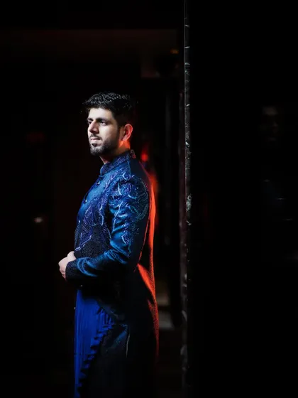 A moody and artistic portrait of the groom.