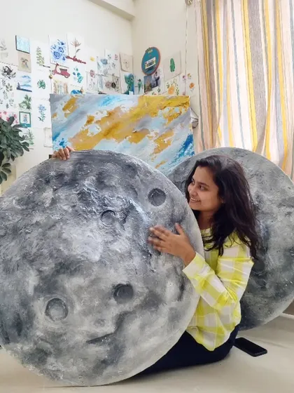 A happy moment in the studio with our handcrafted moon art. Each piece truly feels like a part of us, and we love sending that positive energy to our clients.