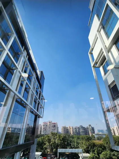 A view from the skybridge at Venkateshwar Hospital, looking out at the two connecting buildings. The design ensures architectural consistency between the existing and new structures.