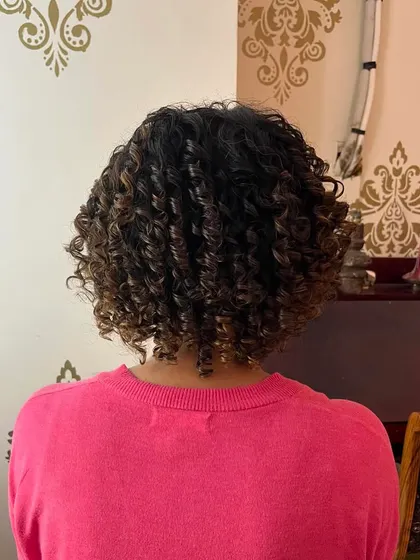 The back view, showing the even distribution of curls and the clean shape of the bob.