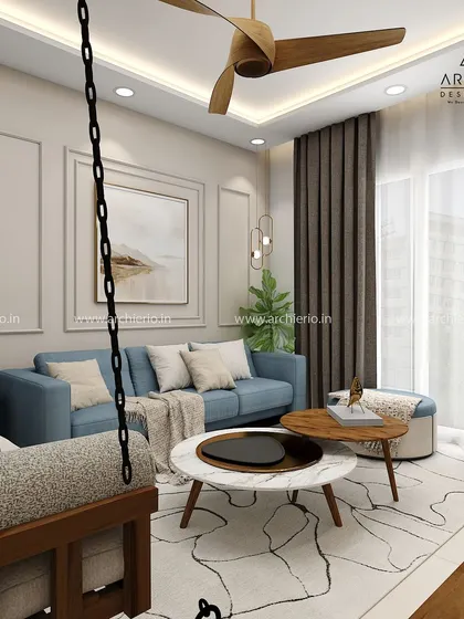 A living room that perfectly balances style and comfort. The design includes a traditional wooden swing, a modern blue sofa, and elegant wall mouldings.