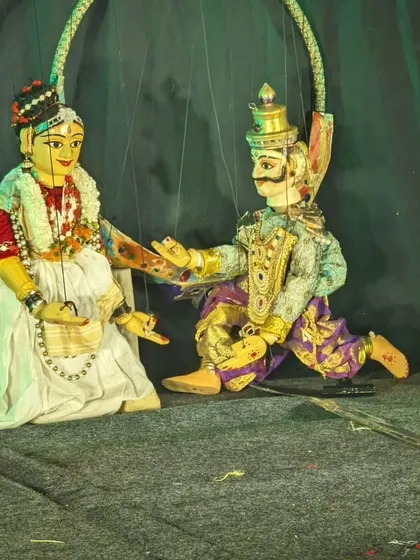 A close-up of two of our string puppets on stage at the Bharatiya Vidya Bhavan. The detailed costumes and expressive features are a testament to the artistry involved in creating each character.