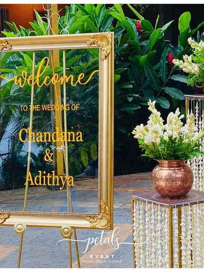 Another view of the beautiful transparent welcome board, surrounded by arrangements of fresh tuberoses.
