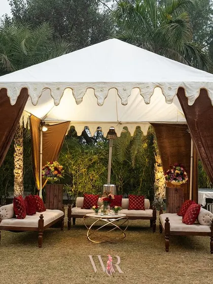 A single royal tent, showcasing its elegant design. The scalloped valance and rich fabric drapes evoke the grandeur of Rajasthani palaces, providing a perfect blend of tradition and luxury.