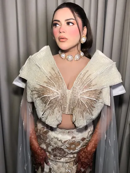 The full look is a masterclass in modern, statement jewelry styling.