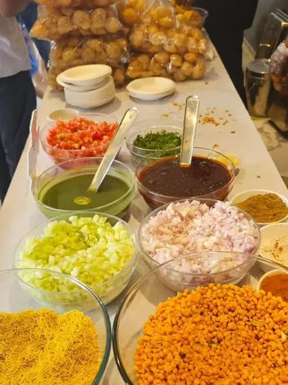 This is the heart of our live chaat station. We provide all the fresh ingredients like chopped onions, tomatoes, chutneys, and crispy puris for an authentic and interactive experience.