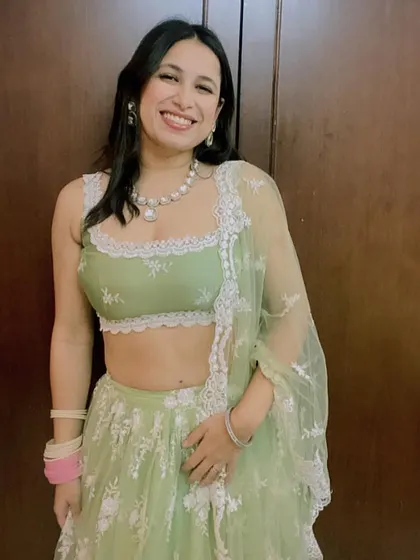A full look of the beautiful pastel green lehenga. This is a great option for a day wedding or an engagement ceremony, offering a fresh and modern aesthetic.