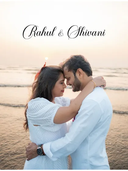 A classic romantic pre-wedding pose on the beach at sunset. The couple embraces, their foreheads touching, with the ocean and setting sun creating a perfect backdrop.