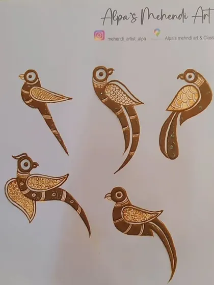 We also practice simpler elements like these bird motifs. This helps in understanding symmetry, flow, and how to create smaller filler designs.