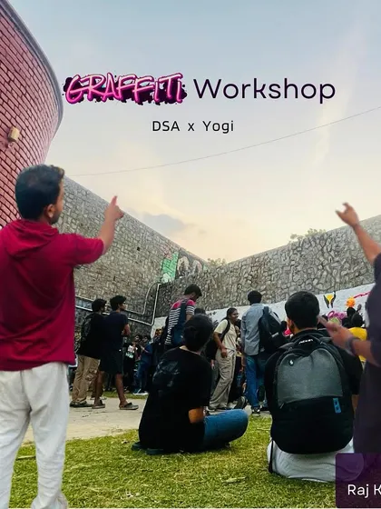 Here I am with my co-artist, guiding the students at the start of our graffiti session at IIT Delhi. We believe in teaching by doing, getting everyone involved from the very first moment to create a sense of shared ownership over the final piece.