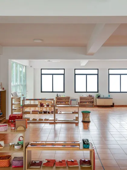 The shelves are filled with scientifically designed Montessori materials, each with a specific purpose. This organized and accessible setup is key to child-directed learning.