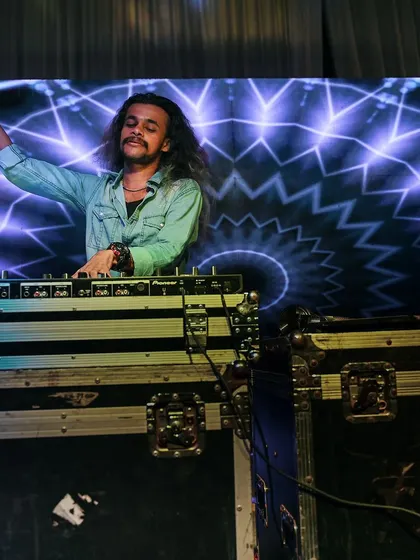 A moment of enjoyment at the decks, feeling the music and the vibe of the wedding party.