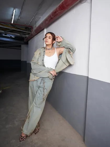 A more relaxed pose that still carries all the attitude. The oversized silhouette of the denim co-ord set is the key to this look.