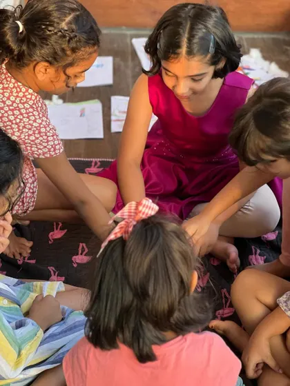 A circle of friends sharing a moment during our art class. These sessions are as much about building friendships as they are about making art.