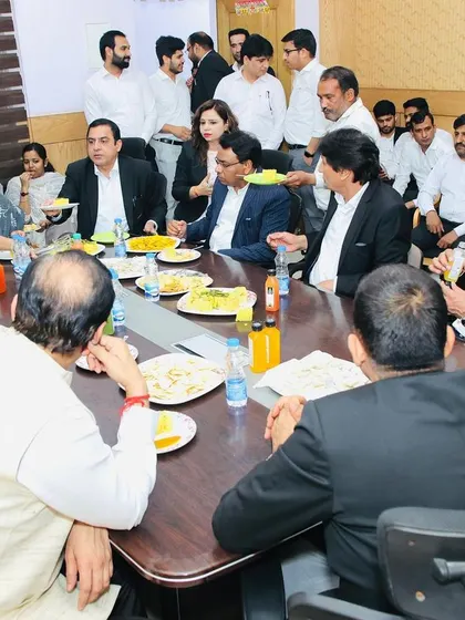 A candid moment of discussion over lunch at the farewell event. Open communication is key to a healthy legal ecosystem.