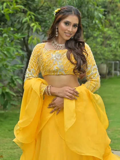 A happy and bright portrait in the yellow lehenga, perfect for capturing the joyful spirit of a Haldi ceremony.