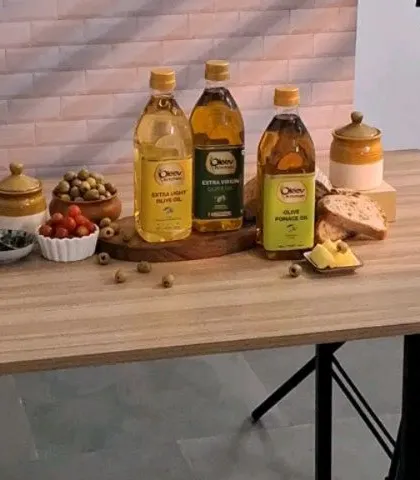 The full tabletop setup for the Oleev Kitchen group shot, showing the arrangement of products, ingredients, and lighting.