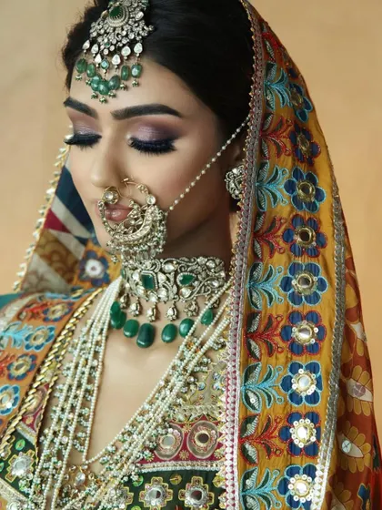 A beautiful bridal look with a multi-colored dupatta. Learn how to work with complex outfits and color schemes in my Delhi masterclass.